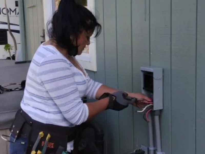 Licensed electrician wiring an exterior subpanel in Mead