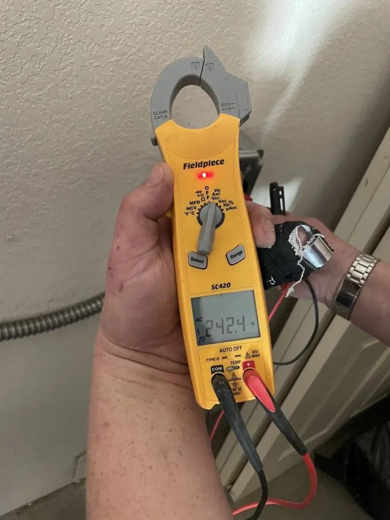 Voltage testing with clamp meter during Generator Installation in Mead